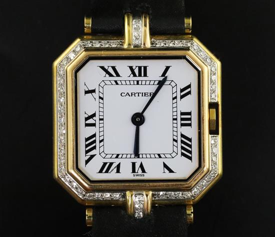 A ladys 18ct gold and diamond set Cartier quartz octagonal cased wrist watch, and Cartier box.